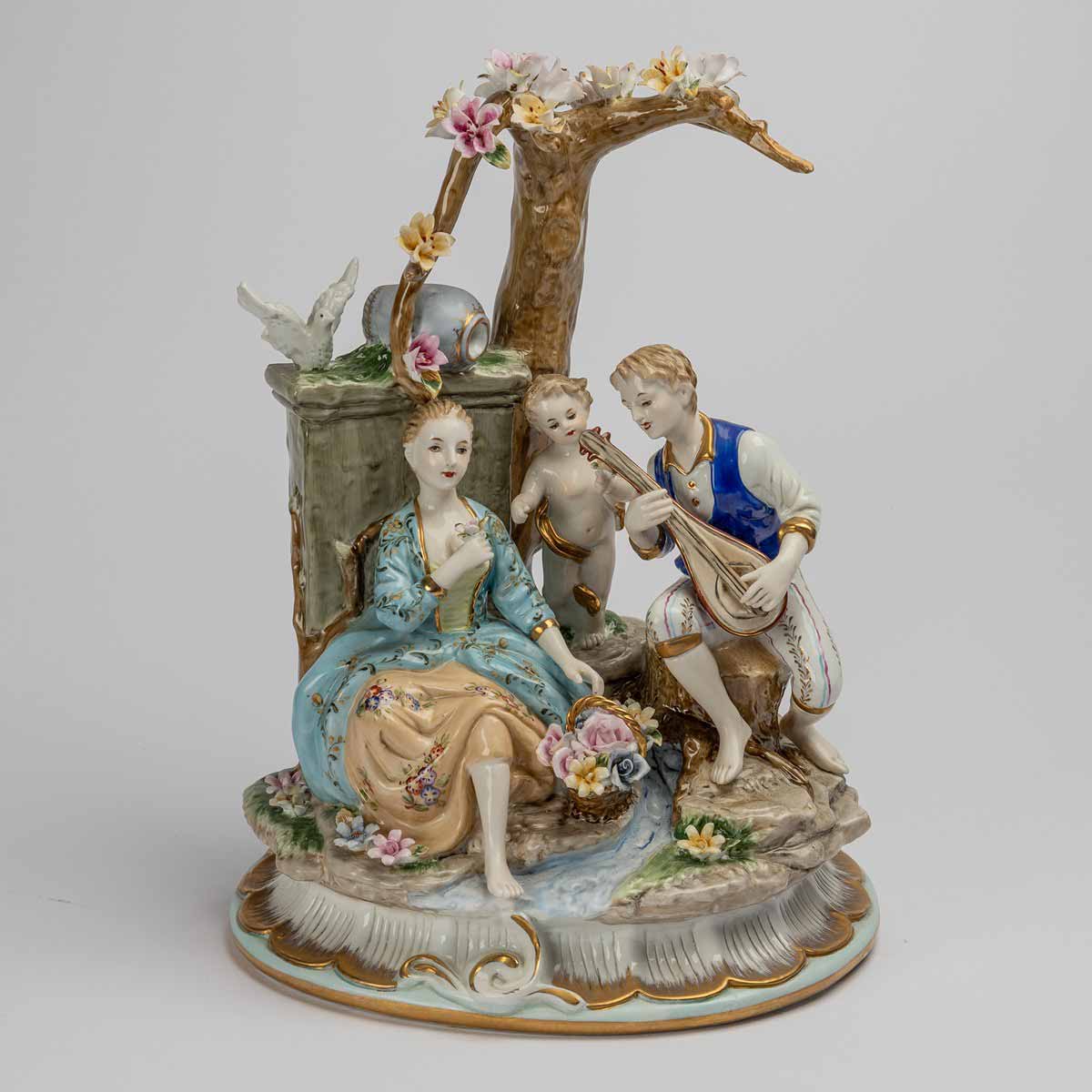 Milenci pod stromem s andílkem